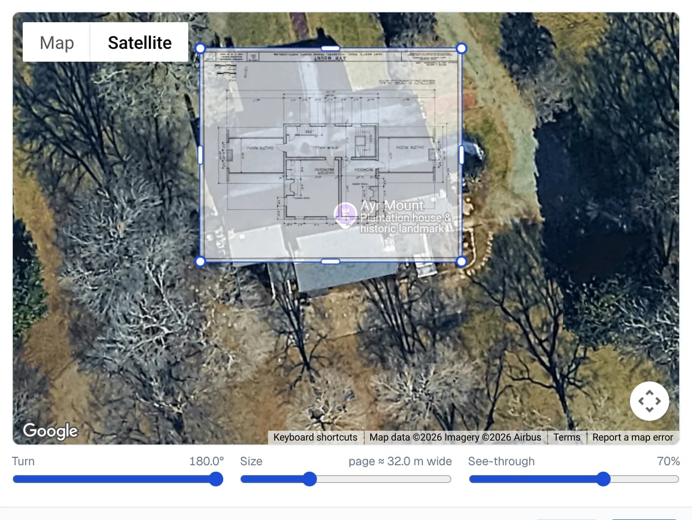 GeoLocation setup in Jobivo: a floor plan laid see-through over a house on Google Maps satellite imagery, with corner handles to turn it and edge handles to size it.
