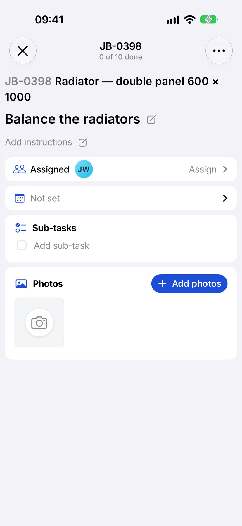 A task opened, with Assigned, the date, Sub-tasks and Photos