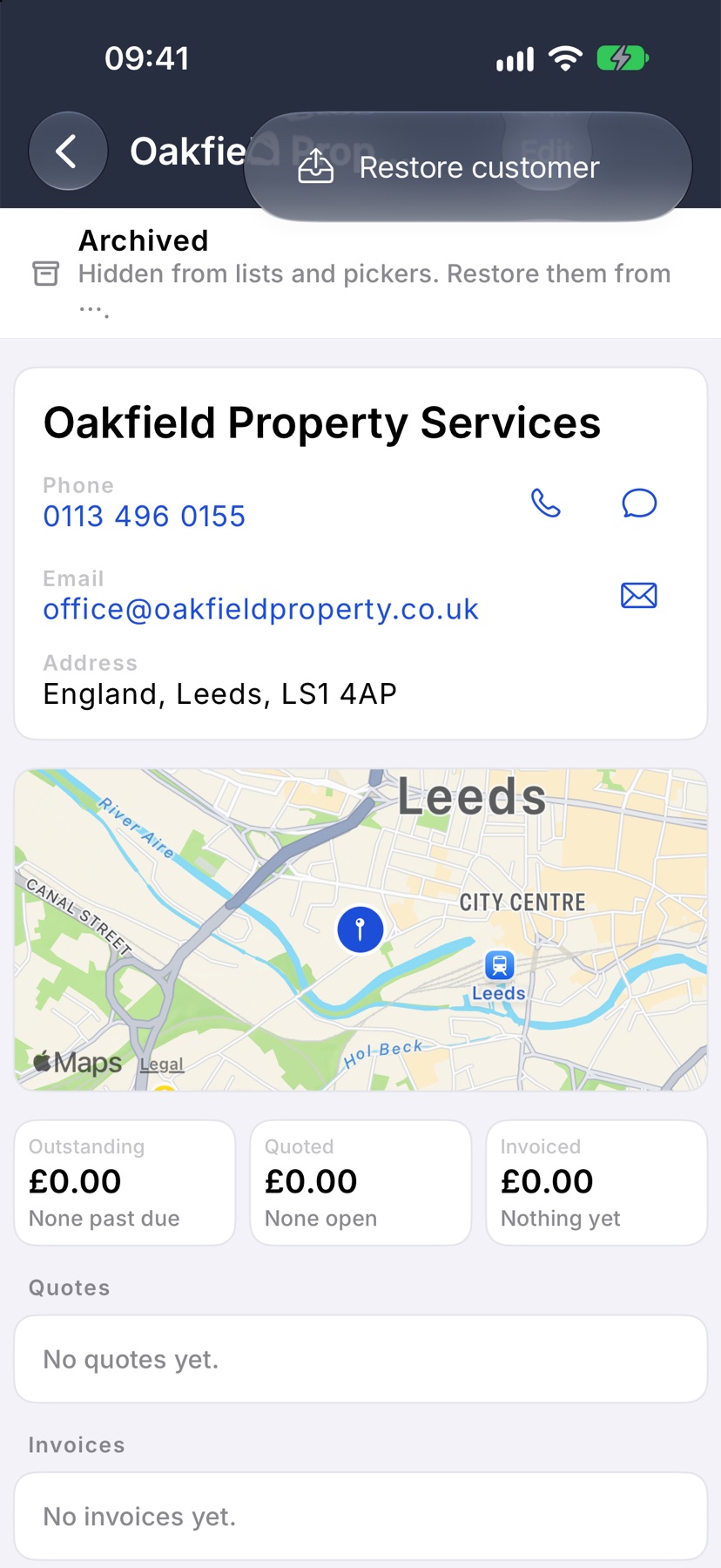 The archived Oakfield Property Services customer page with the Archived band at the top and the three-dot menu open showing Restore customer