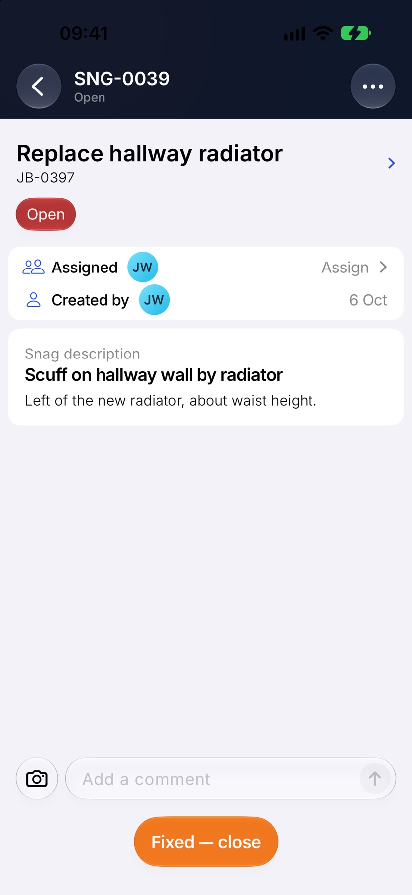 A snag page, status Open, showing the job, the Assigned and Created by rows, the description and the Add a comment box